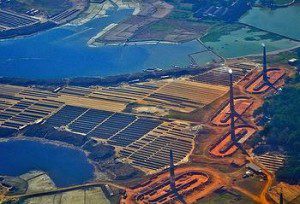 smoking chimneys of the brick kilns on Beribandh - the protective dam encircling the city of Dhaka, Bangladesh (photo by Azim Safia)
