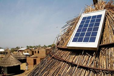 Solar panel on a traditional grass home in Rwanda (Photo by Azuri Technologies