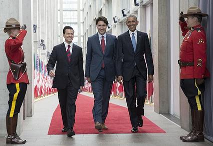 PHOTO: The three North American leaders enter the conference hall in Ottawa, from left, President Enrique Peña Nieto, Prime Minister Justin Trudeau and President Barack Obama, June 29, 2016. (Photo courtesy The White House)