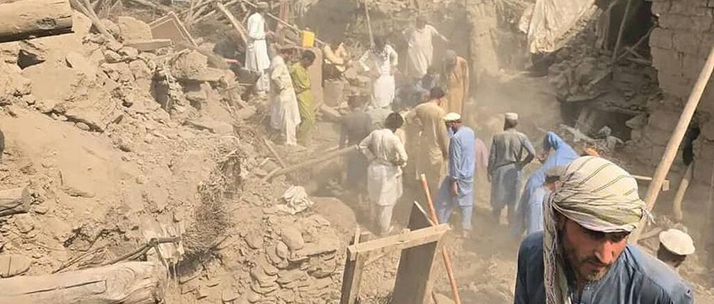 Survivors search earthquake rubble