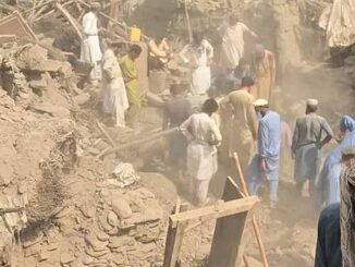 Survivors search earthquake rubble